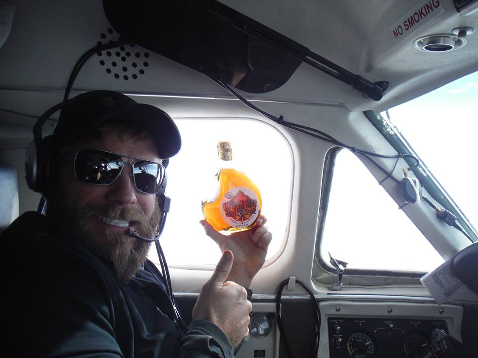 pilot holding up syrup