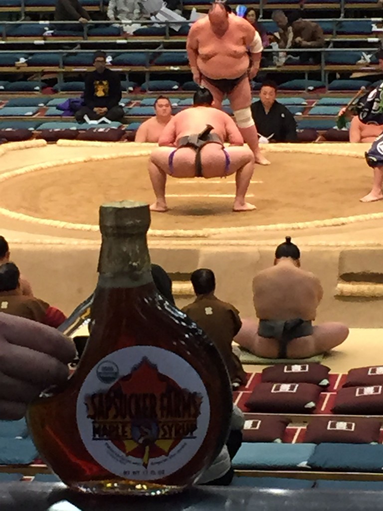 Maple syrup bottle with sumo wrestlers