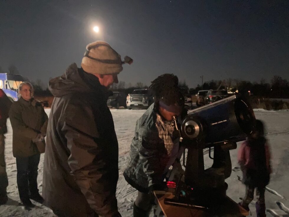 looking through telescope in the winter